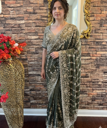 Heavy embroidered green saree