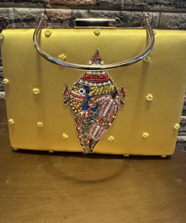 Beautiful clutch with art work with pearl and stones