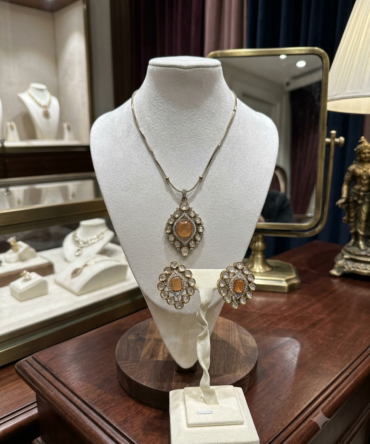 Orange color stone pendent set
